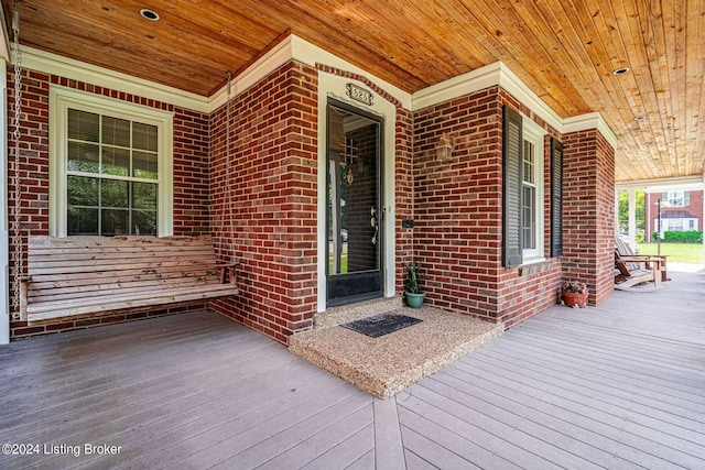 wooden terrace with a porch