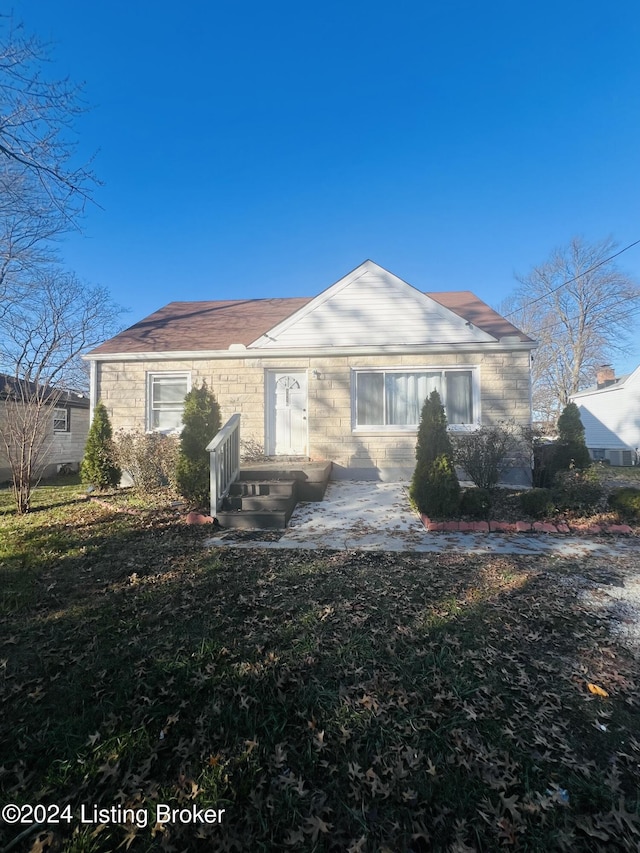 rear view of house with a lawn