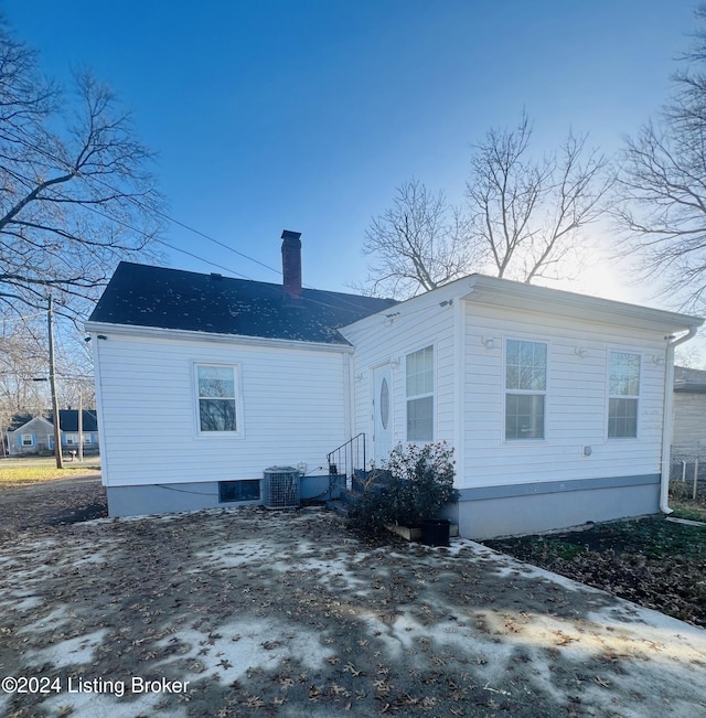 back of property with central AC