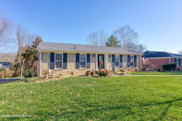 ranch-style home with a front yard