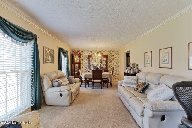 carpeted living room with a textured ceiling, an inviting chandelier, and ornamental molding