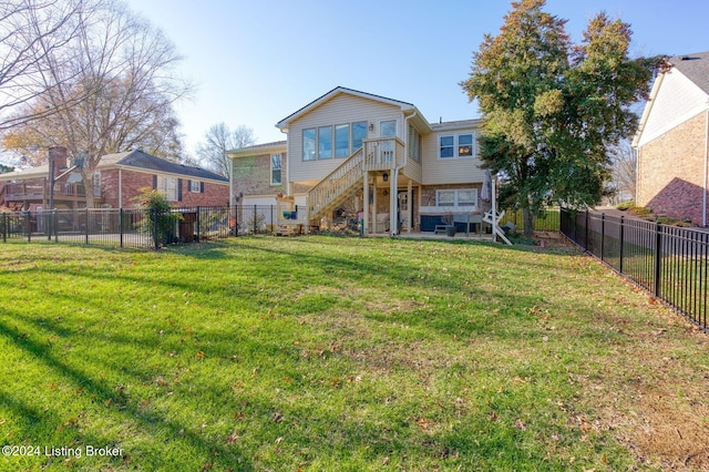 back of house with a yard