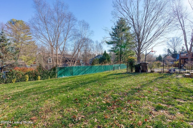 view of yard featuring basketball court