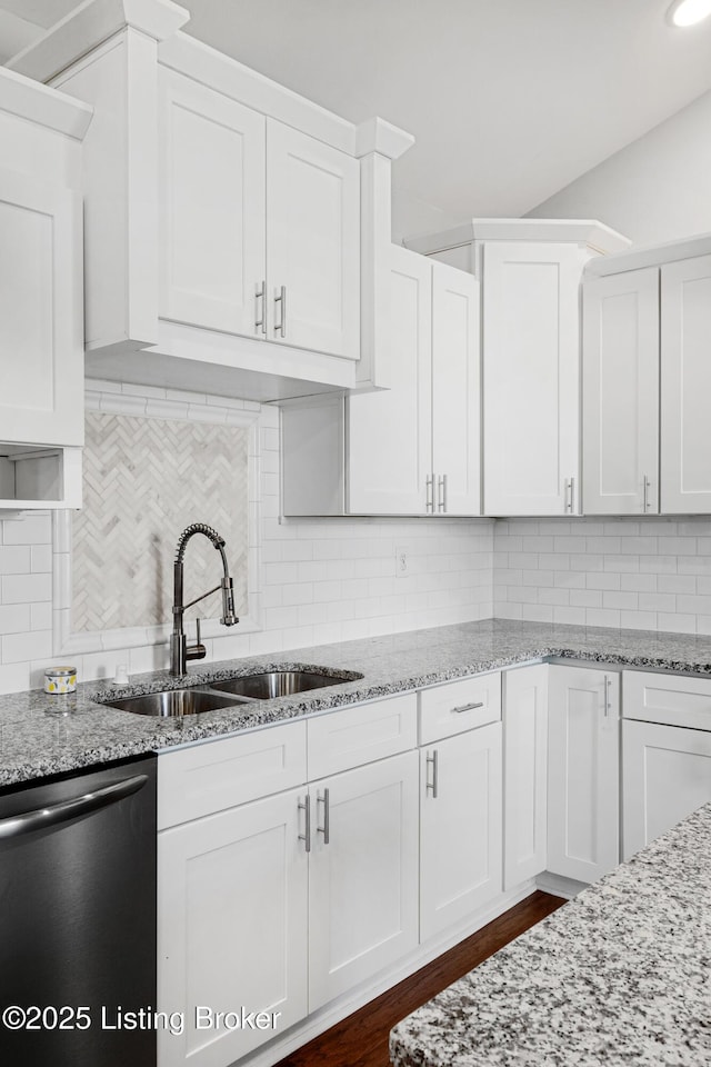 kitchen with stainless steel dishwasher and white cabinets