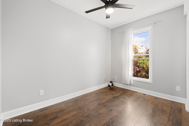 empty room featuring dark hardwood / wood-style floors and ceiling fan