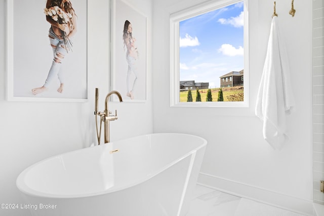 bathroom with a washtub