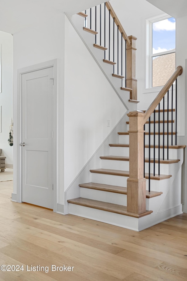 staircase featuring hardwood / wood-style flooring