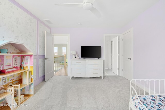 bedroom with ceiling fan and light colored carpet