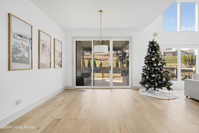 unfurnished dining area with light wood-type flooring