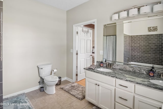 bathroom featuring toilet, vanity, tile patterned floors, and walk in shower