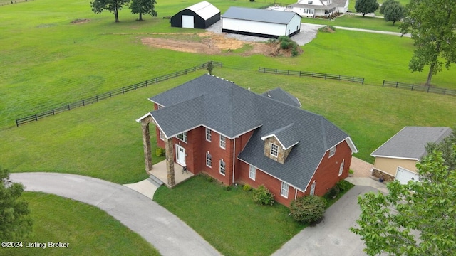 birds eye view of property with a rural view