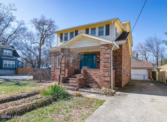 view of front of house with a garage and an outdoor structure