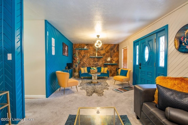 living room featuring carpet flooring and a textured ceiling