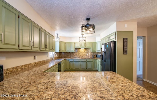 kitchen with black appliances, sink, tile patterned flooring, a textured ceiling, and kitchen peninsula