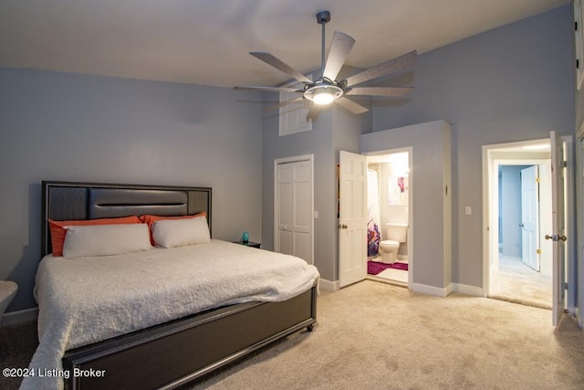 bedroom with light carpet, connected bathroom, a closet, and ceiling fan