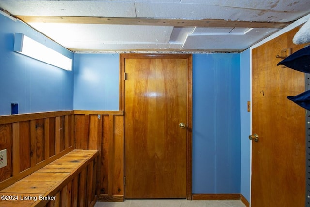 interior space featuring wooden walls