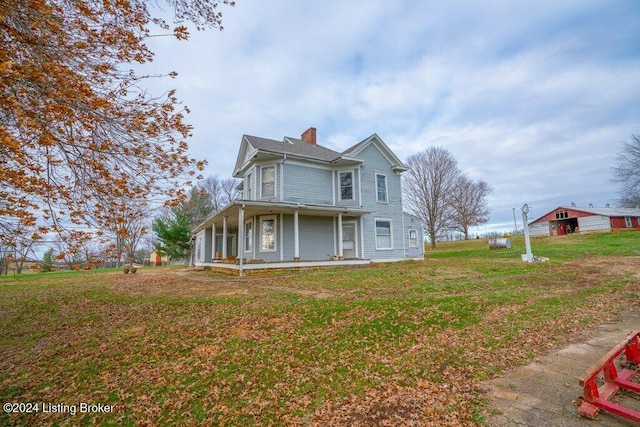 view of front of house with a front lawn and a porch