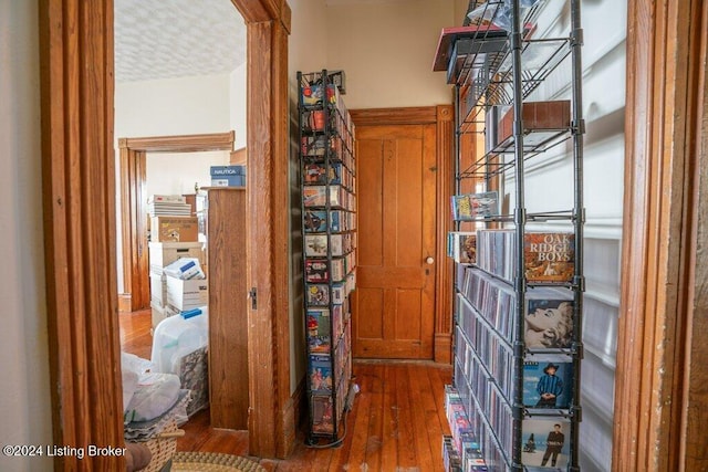 hallway with dark hardwood / wood-style floors