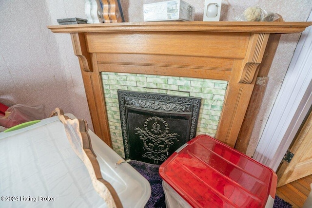 interior details with a tile fireplace