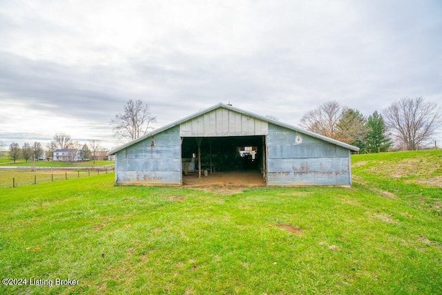 view of outbuilding featuring a yard