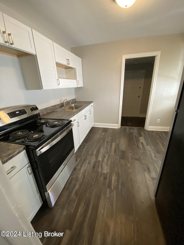 kitchen featuring white cabinets, dark hardwood / wood-style flooring, sink, and electric range