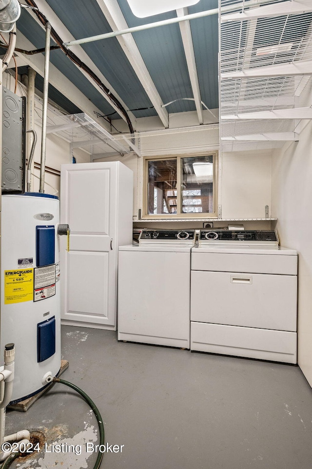 clothes washing area with separate washer and dryer and electric water heater