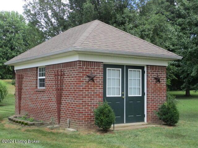 view of side of home featuring a yard