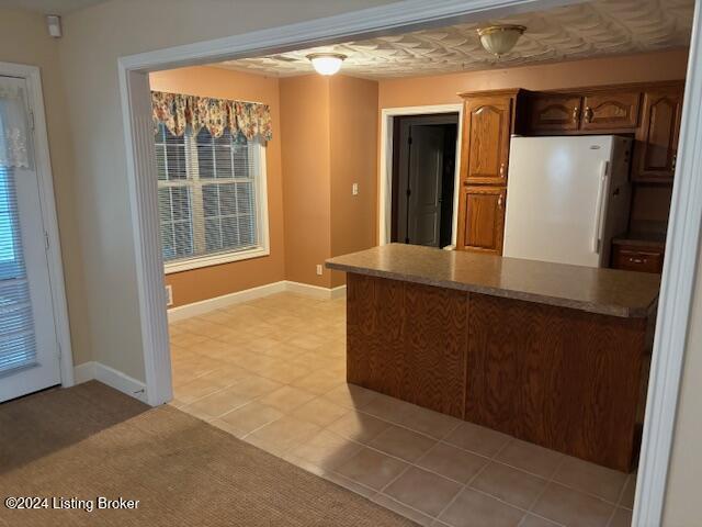 kitchen featuring white fridge