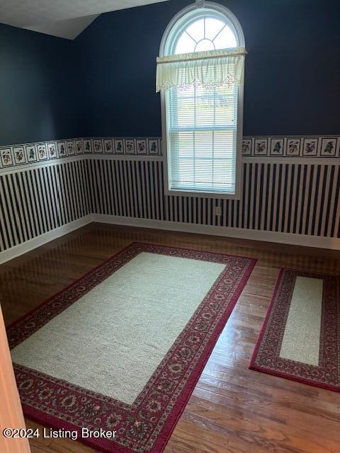 spare room featuring hardwood / wood-style floors