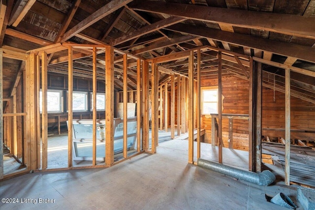 miscellaneous room with lofted ceiling