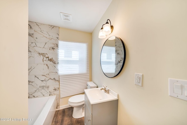 full bathroom with toilet, vanity,  shower combination, and hardwood / wood-style flooring