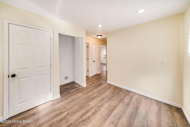 unfurnished room with light hardwood / wood-style floors