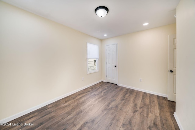 empty room featuring dark hardwood / wood-style floors