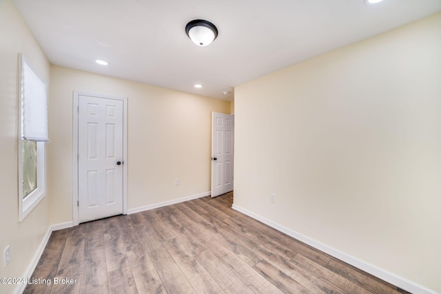 empty room featuring wood-type flooring