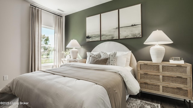 bedroom featuring dark hardwood / wood-style flooring