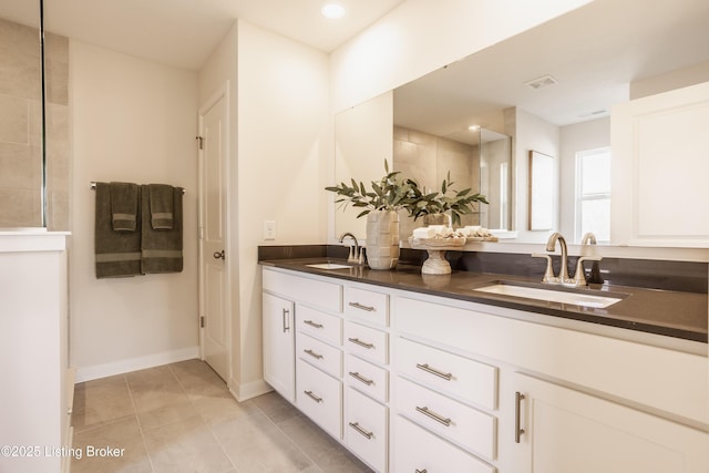 bathroom featuring vanity and tile patterned flooring