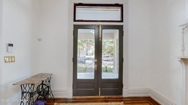 entryway featuring plenty of natural light, dark hardwood / wood-style floors, and french doors