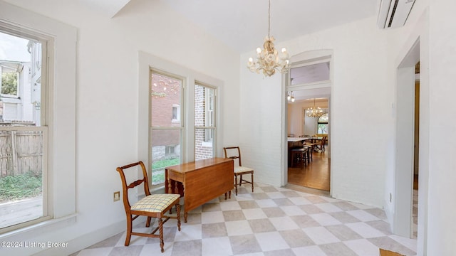 dining space featuring a notable chandelier