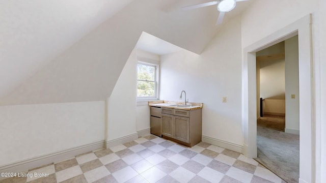 bathroom featuring vanity, ceiling fan, and lofted ceiling