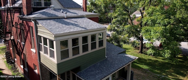 view of side of property featuring a yard