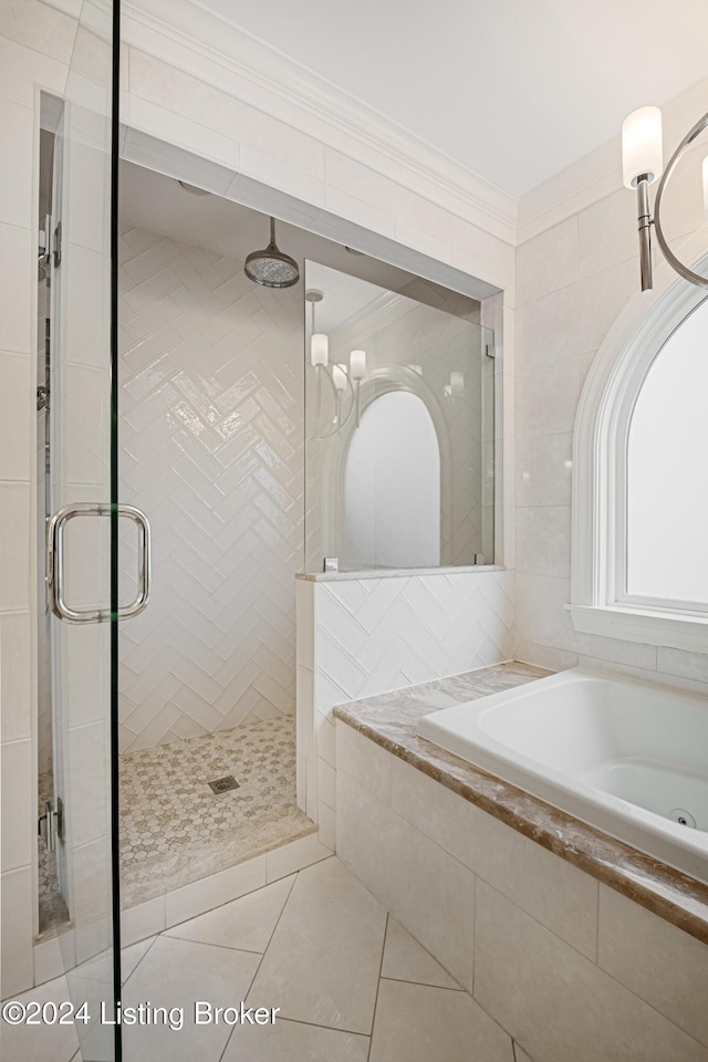 bathroom with crown molding, separate shower and tub, and tile patterned floors