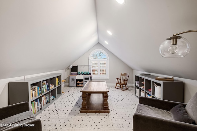 recreation room with vaulted ceiling and carpet