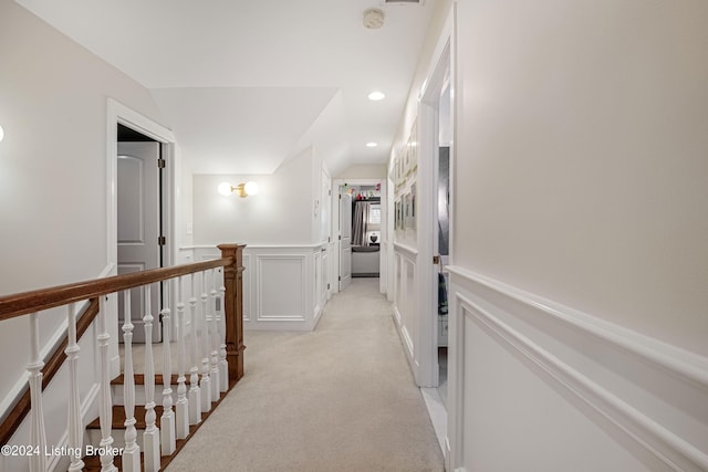 hallway with light carpet