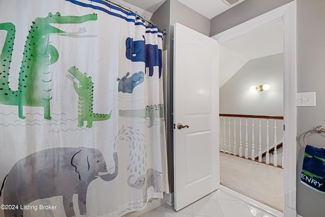 bathroom with tile patterned floors