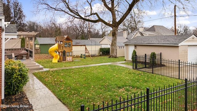 view of yard with a playground and a storage unit