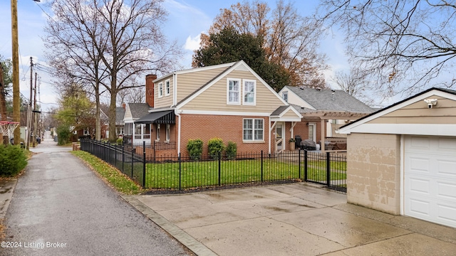 view of front facade featuring a garage, an outbuilding, and a front lawn