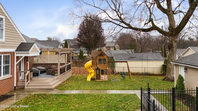 view of yard featuring a playground and a wooden deck