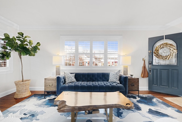 living area featuring ornamental molding and dark wood-type flooring