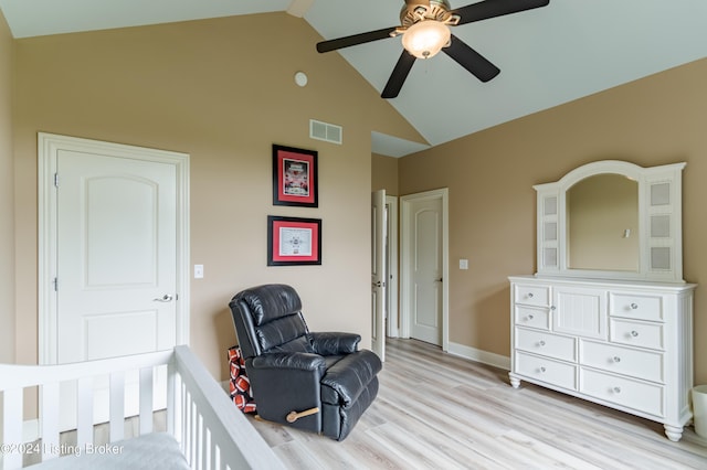 bedroom with ceiling fan, light hardwood / wood-style flooring, and vaulted ceiling