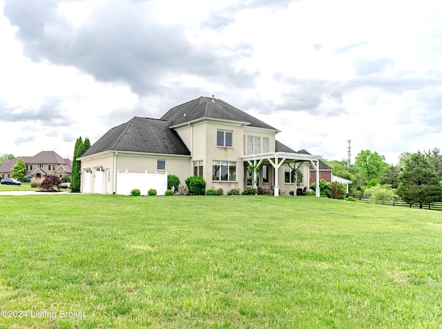 view of front facade with a front lawn and a garage